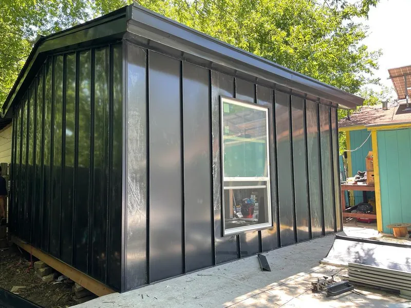 Black standing seam metal wall panels for Roof Inspection in Metairie